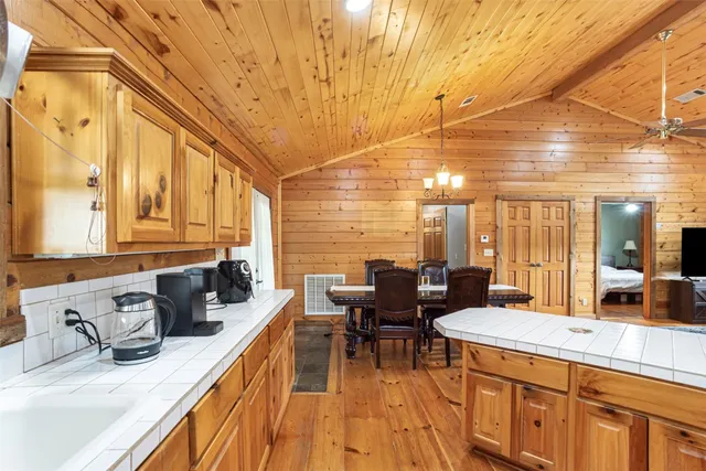 a kitchen with stainless steel appliances granite countertop a sink and cabinets