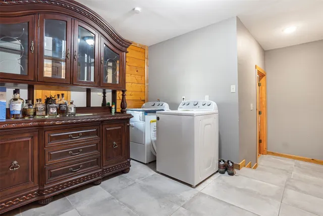 a view of a hallway with wooden shelves