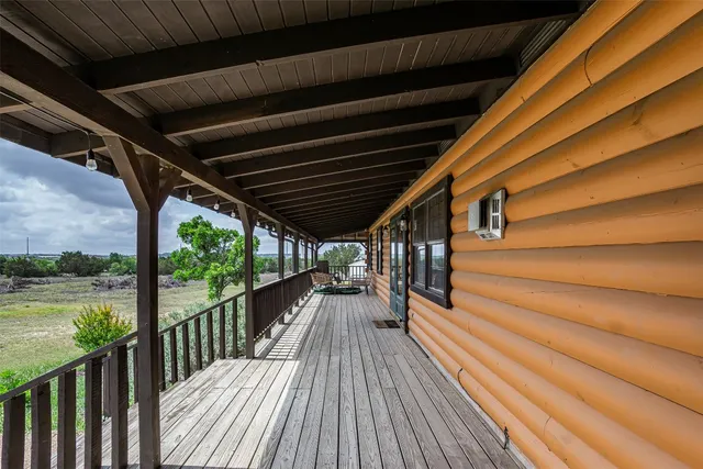 a view of balcony with wooden floor
