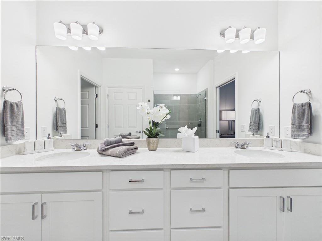 5683 Mayflower Way, Unit 908 Ave Maria, FL 34142 - Photo 27 of 37 Full bath featuring double vanity and a shower stall