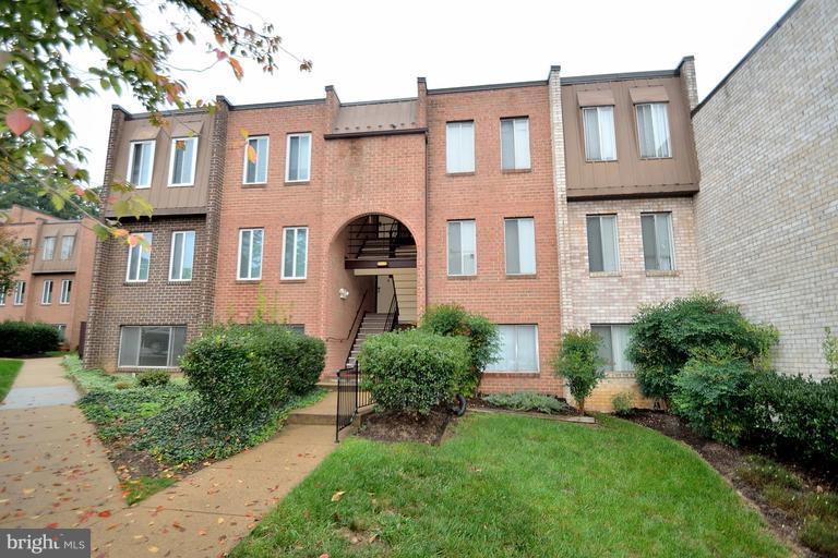 5033 7th Road South, Unit 101 Arlington, VA 22204 - Photo 1 of 13 a front view of a house with a yard