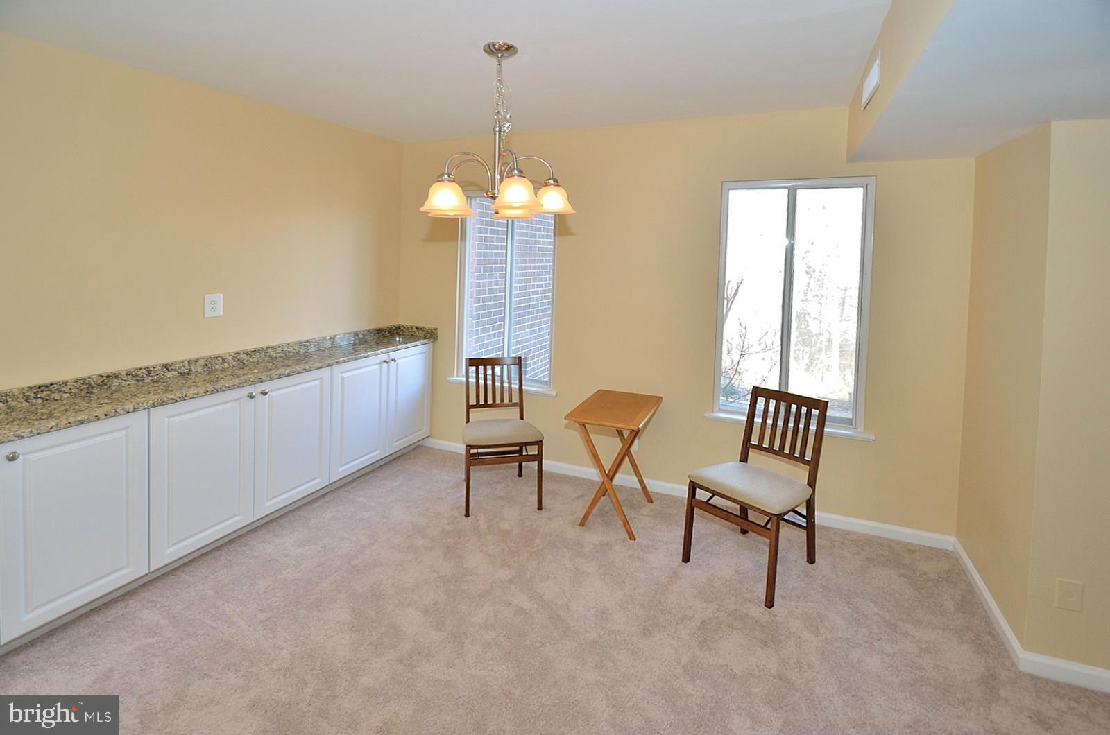 5033 7th Road South, Unit 101 Arlington, VA 22204 - Photo 5 of 13 a view of a room with a furniture wooden floor and windows