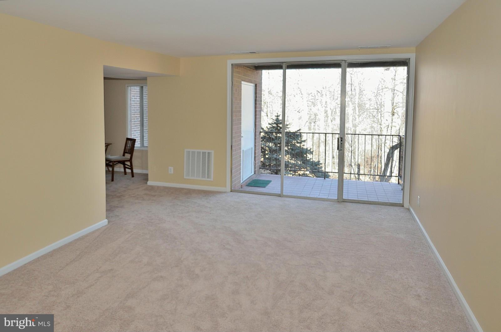 5033 7th Road South, Unit 101 Arlington, VA 22204 - Photo 9 of 13 an empty room with large windows