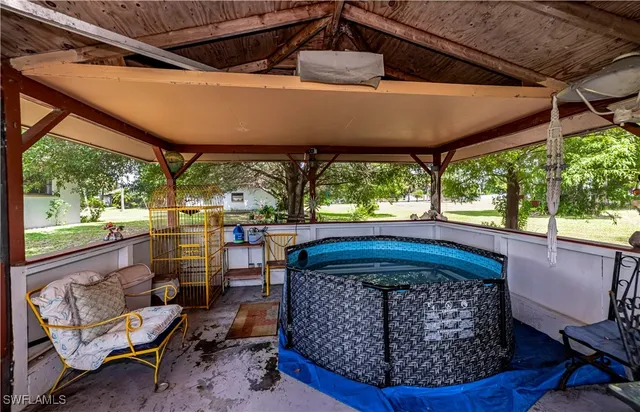a patio with table and chairs