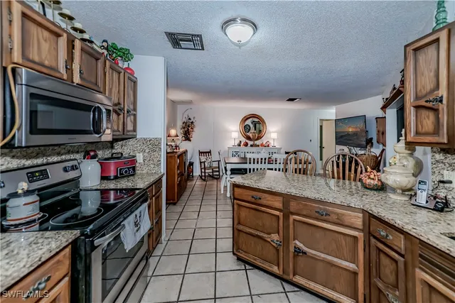 a view of a dining room and kitchen