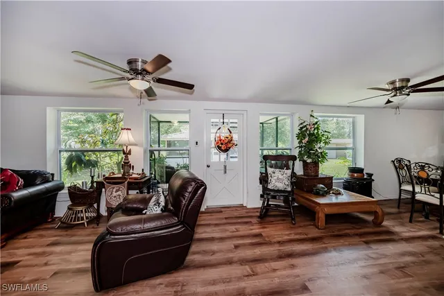a view of a dining room with furniture and window