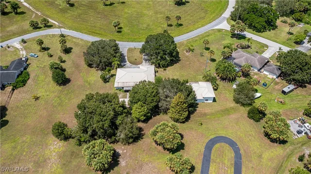 an aerial view of a residential houses with outdoor space