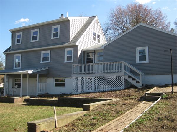 10 Silvermine Road Woburn, MA 01801 - Photo 4 of 14 a front view of a house with a yard