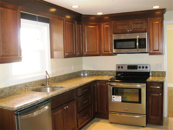 10 Silvermine Road Woburn, MA 01801 - Photo 6 of 14 a kitchen with stainless steel appliances granite countertop a sink and a microwave