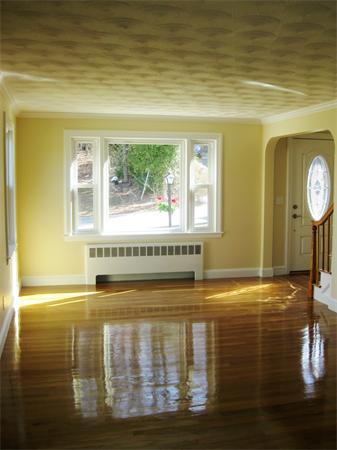 10 Silvermine Road Woburn, MA 01801 - Photo 9 of 14 a view of water heater room with wooden floor