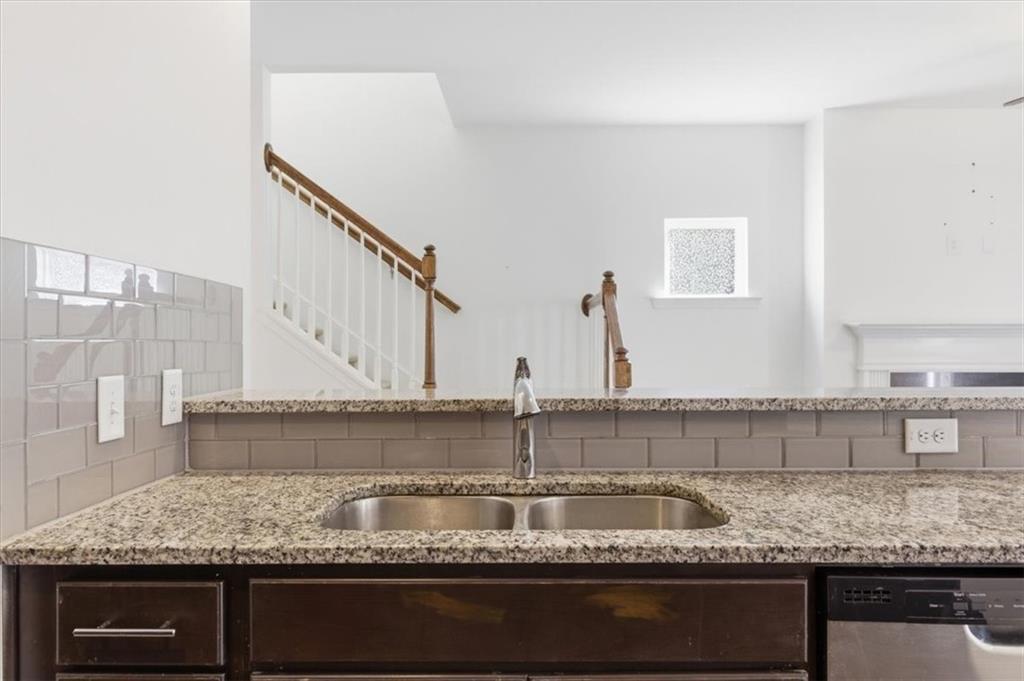 5064 Longview Walk Decatur, GA 30035 - Photo 18 of 30 a kitchen with granite countertop a sink and a granite counter tops