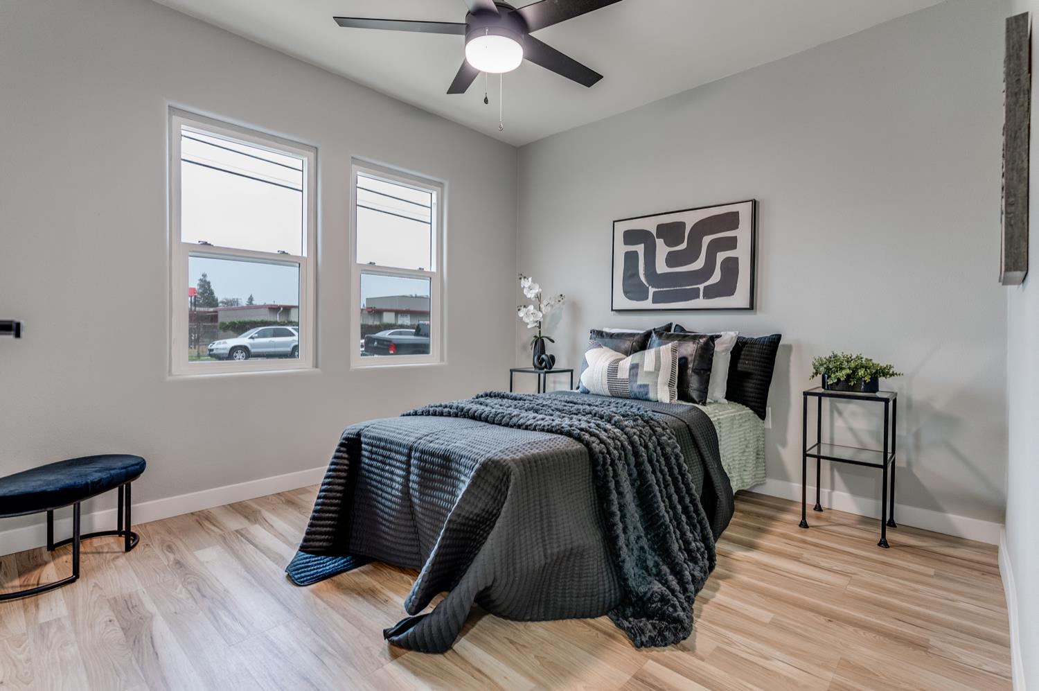 136 North Acacia Avenue Ripon, CA 95366 - Photo 15 of 21 a bedroom with a bed and wooden floor