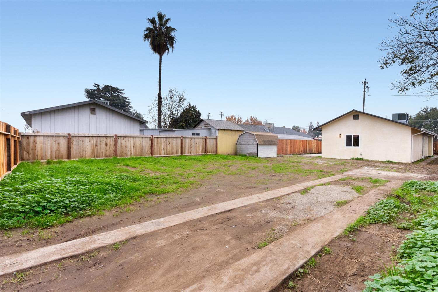 136 North Acacia Avenue Ripon, CA 95366 - Photo 20 of 21 a front view of a house with a yard and garage