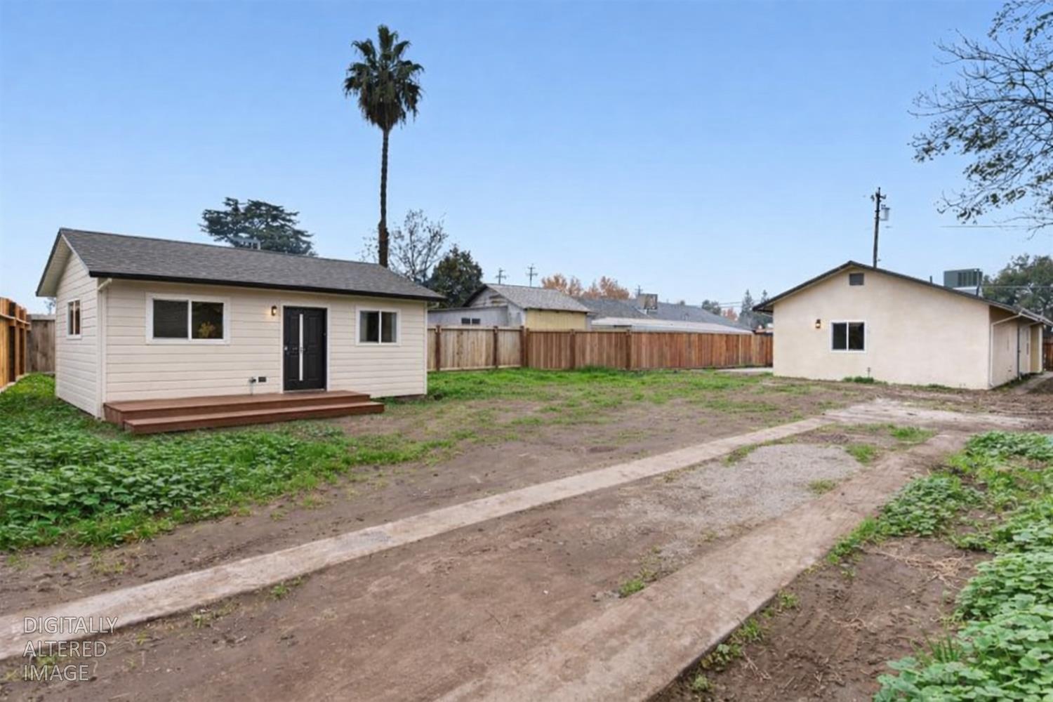 136 North Acacia Avenue Ripon, CA 95366 - Photo 4 of 21 a front view of a house with garden