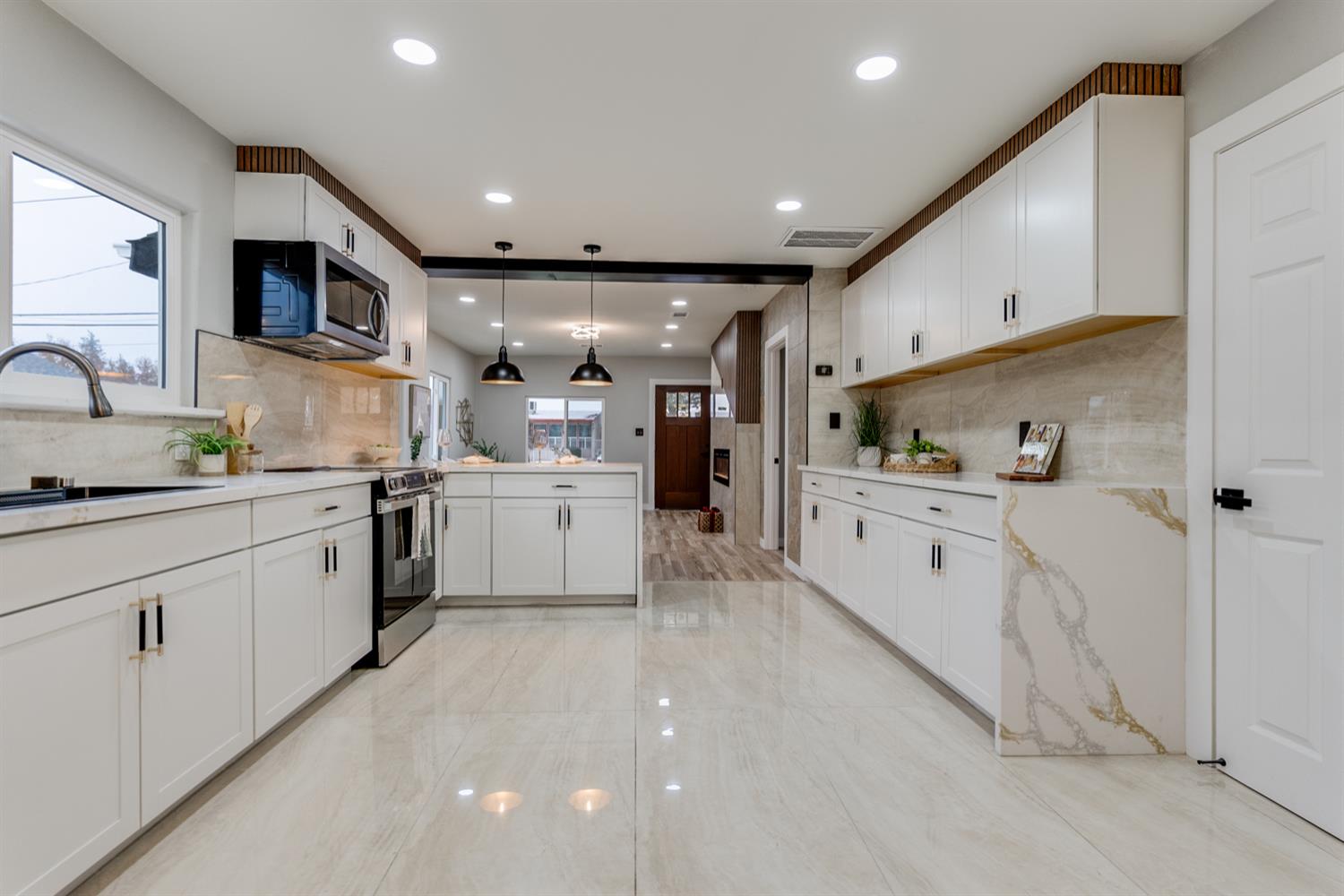 136 North Acacia Avenue Ripon, CA 95366 - Photo 6 of 21 a kitchen with white cabinets and white appliances