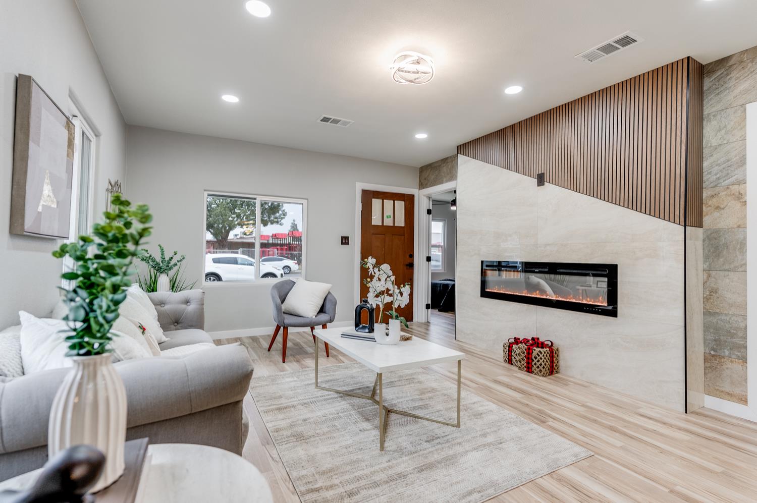 136 North Acacia Avenue Ripon, CA 95366 - Photo 7 of 21 a living room with furniture and a potted plant