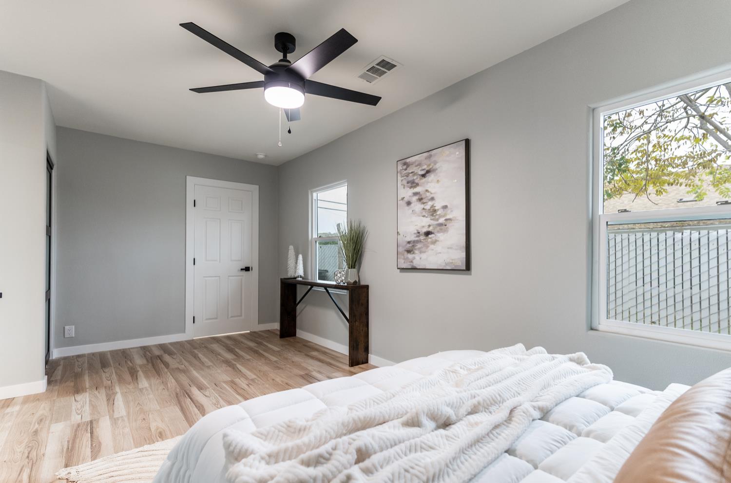 136 North Acacia Avenue Ripon, CA 95366 - Photo 10 of 21 a bedroom with a bed and a painting on the wall