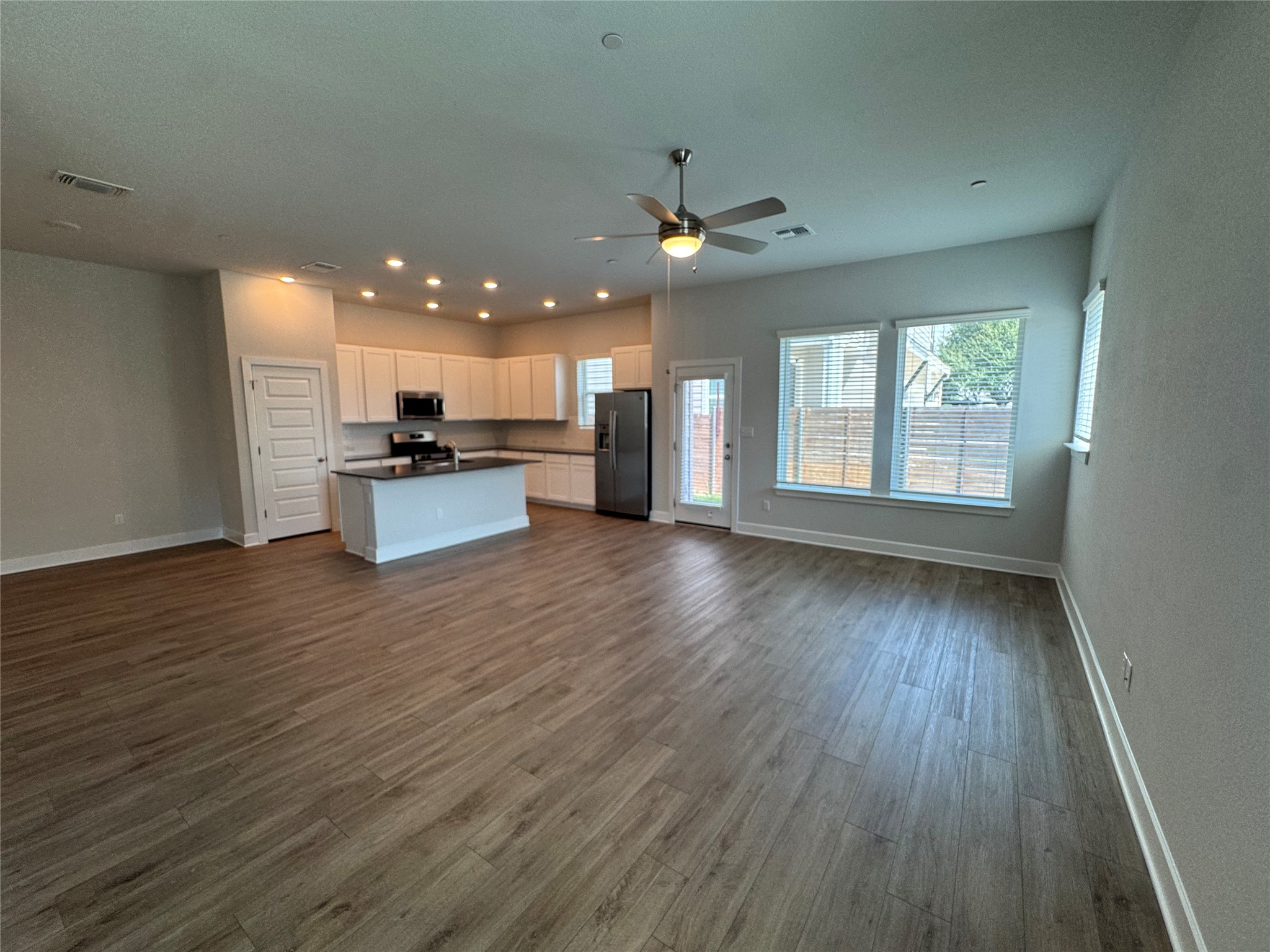 3000 Chisholm Trail Road, Unit 91 Round Rock, TX 78681 - Photo 5 of 27 An open-concept living space with resilient flooring transitions seamlessly into a well-appointed kitchen.