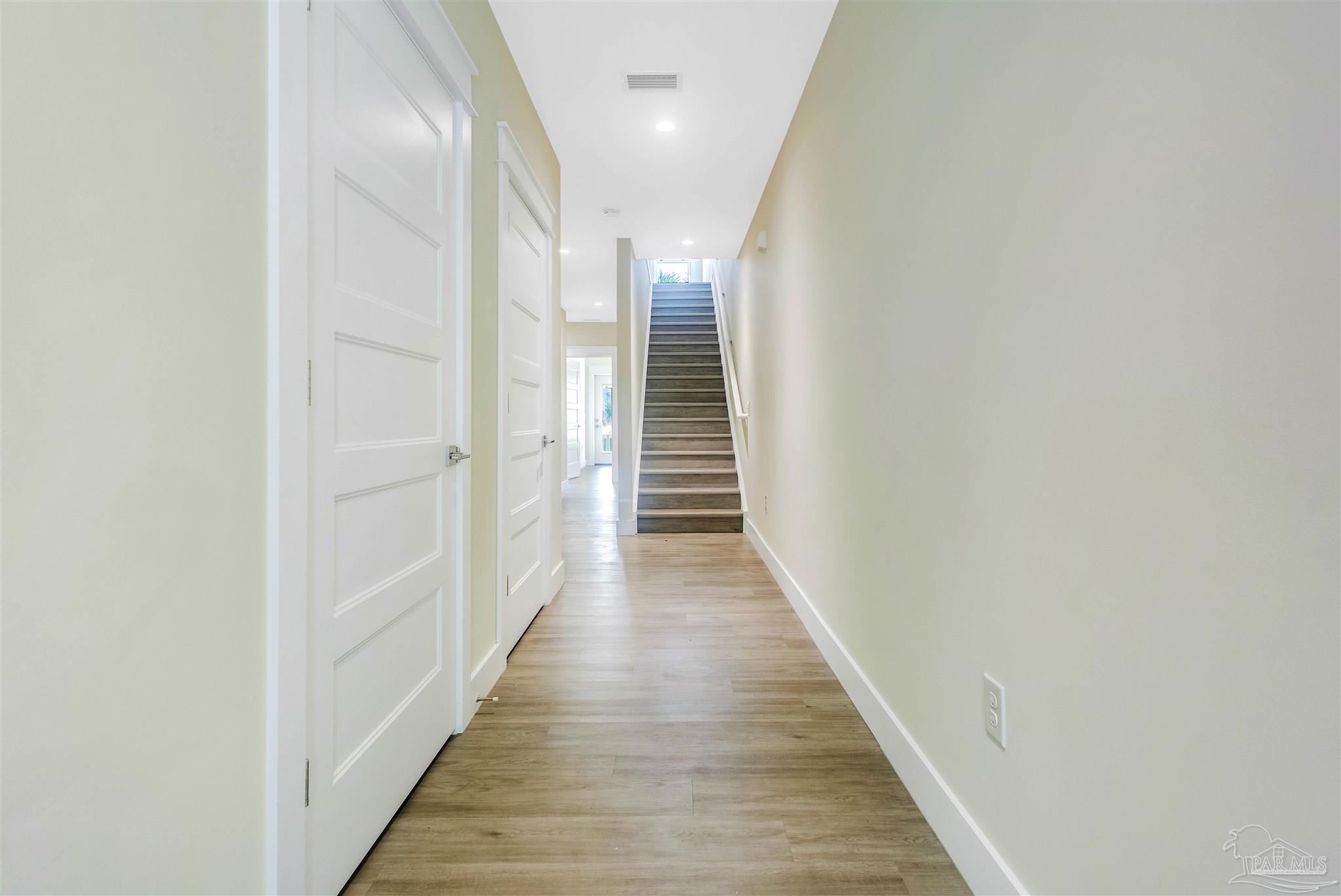 340 Bluefish Drive, Unit 206 Fort Walton Beach, FL 32548 - Photo 17 of 43 a view of a hallway with wooden floor