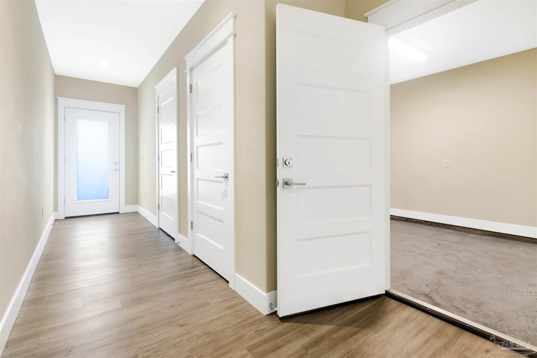 340 Bluefish Drive, Unit 206 Fort Walton Beach, FL 32548 - Photo 26 of 43 a view of a hallway with wooden floor