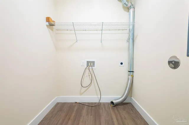 a bathroom with a granite countertop bathtub shower and toilet