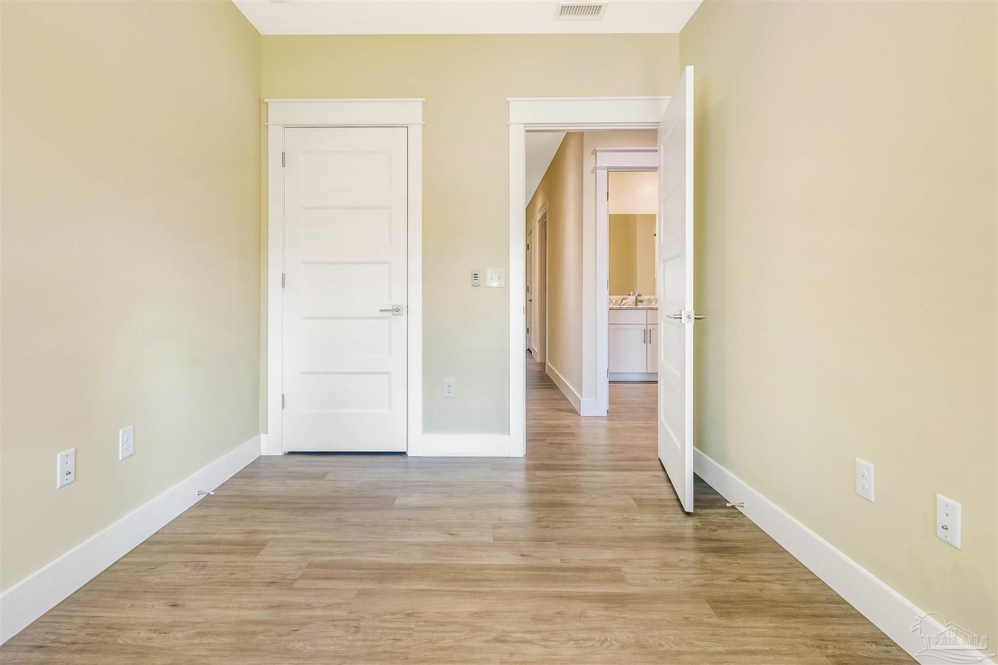 340 Bluefish Drive, Unit 206 Fort Walton Beach, FL 32548 - Photo 33 of 43 a view of a hallway with wooden floor
