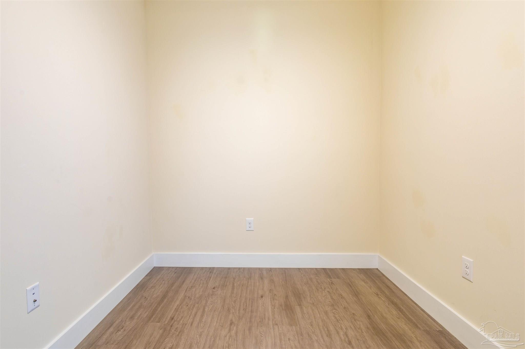 340 Bluefish Drive, Unit 206 Fort Walton Beach, FL 32548 - Photo 34 of 43 a view of a small space with wooden floor and a window