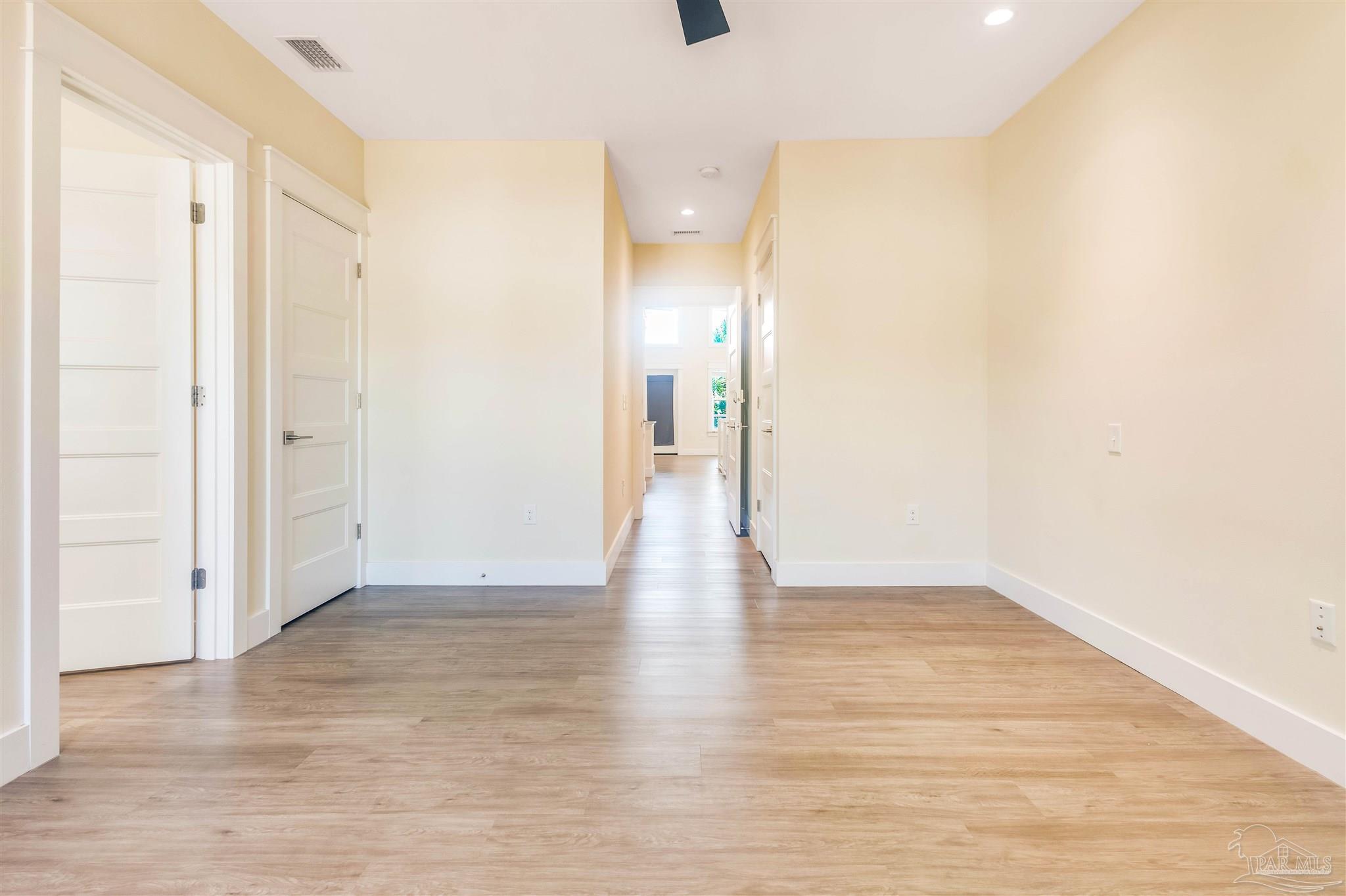 340 Bluefish Drive, Unit 206 Fort Walton Beach, FL 32548 - Photo 39 of 43 a view of an empty room with wooden floor