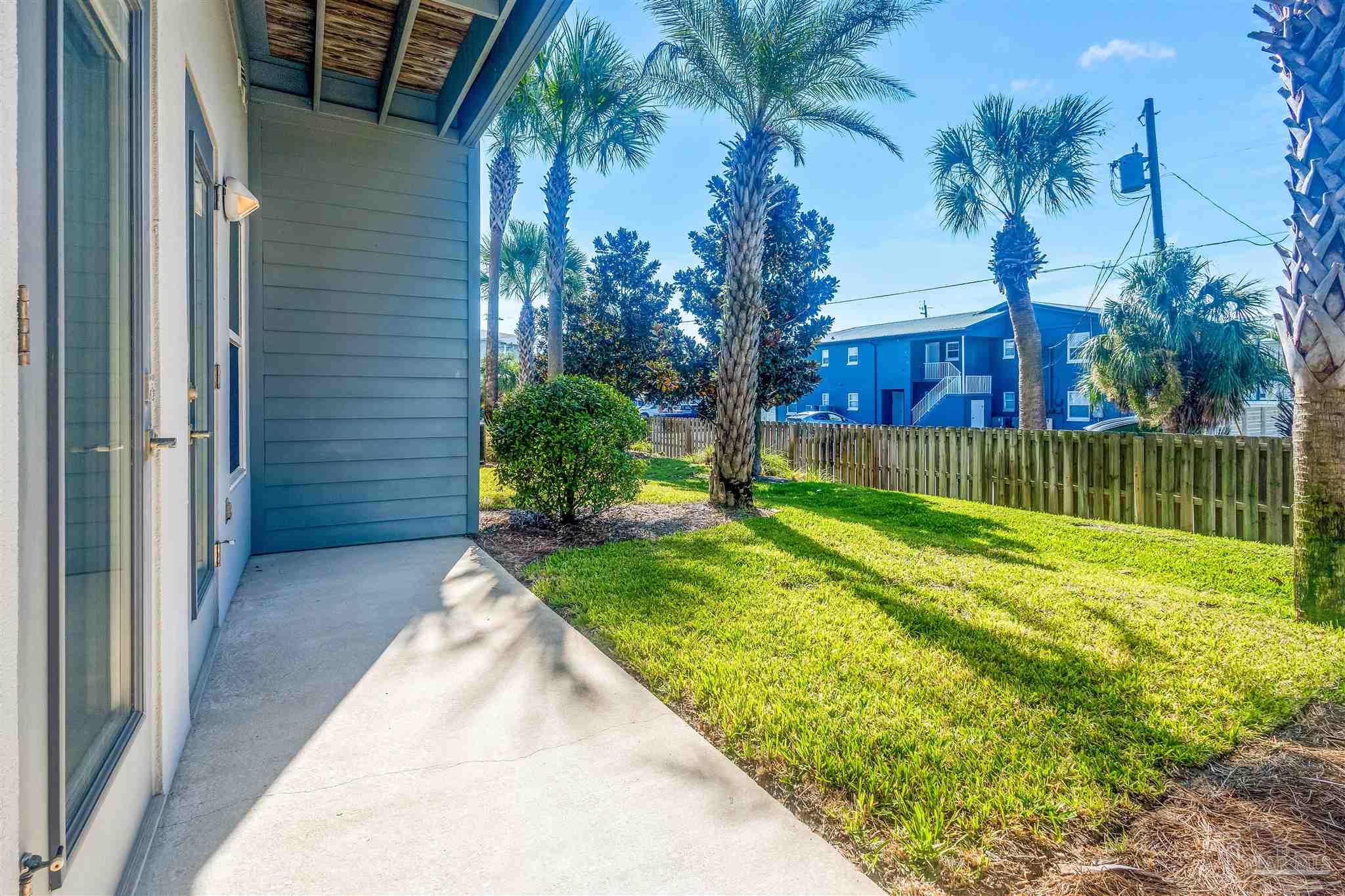 340 Bluefish Drive, Unit 206 Fort Walton Beach, FL 32548 - Photo 4 of 43 a view of a backyard with a garden