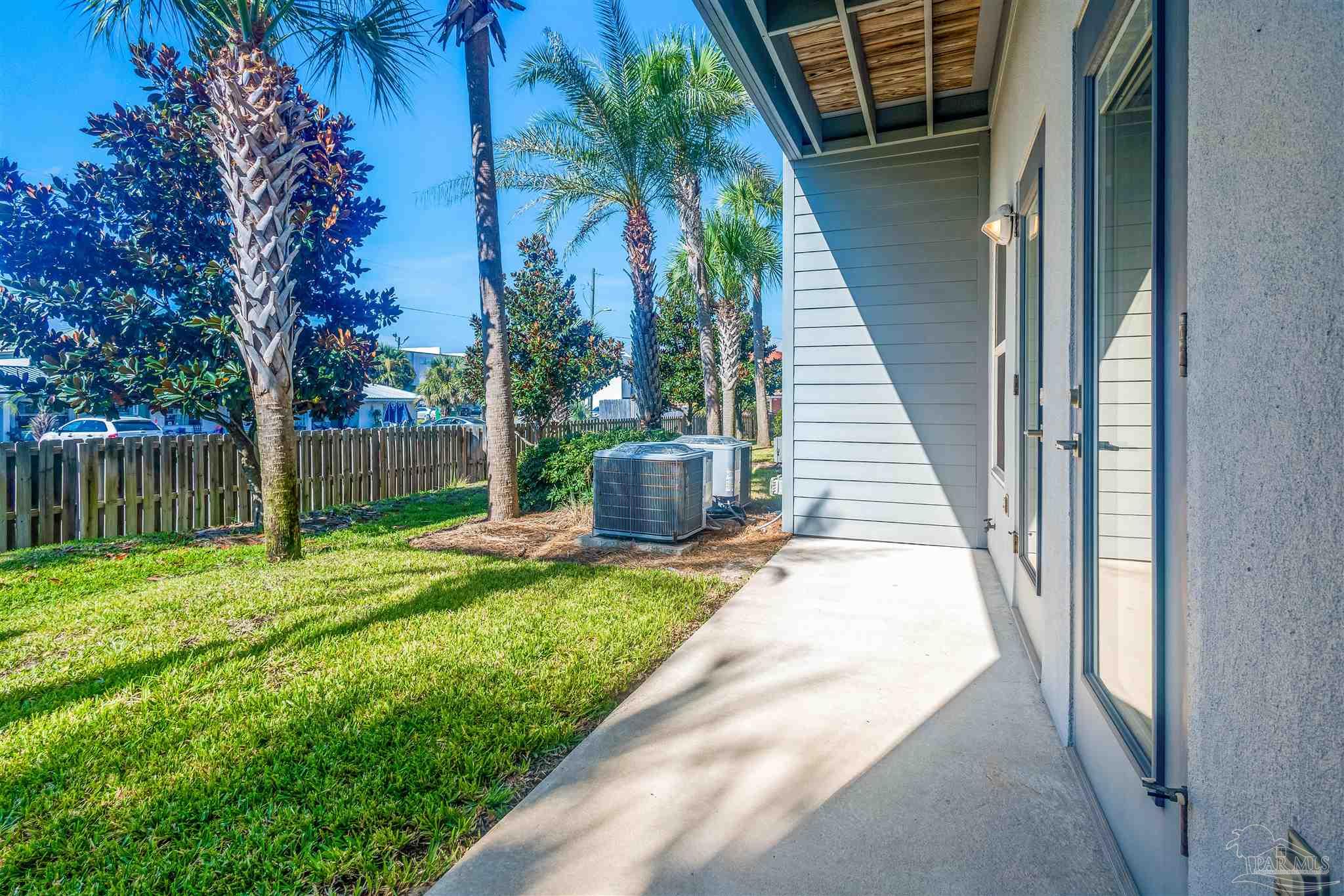 340 Bluefish Drive, Unit 206 Fort Walton Beach, FL 32548 - Photo 5 of 43 a view of a backyard with a garden