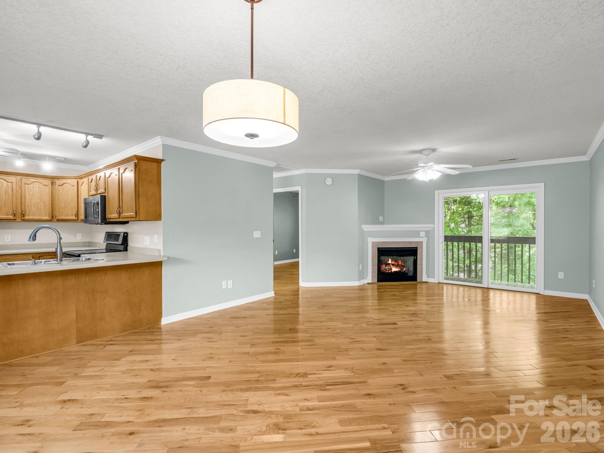 4 Rathfarnham Road, Unit 4F Asheville, NC 28803 - Photo 7 of 33 a view of an empty room with window and kitchen view