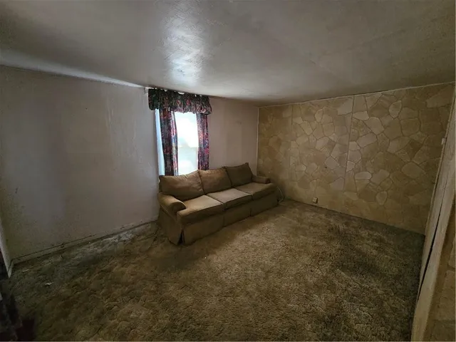 a view of empty room with windows