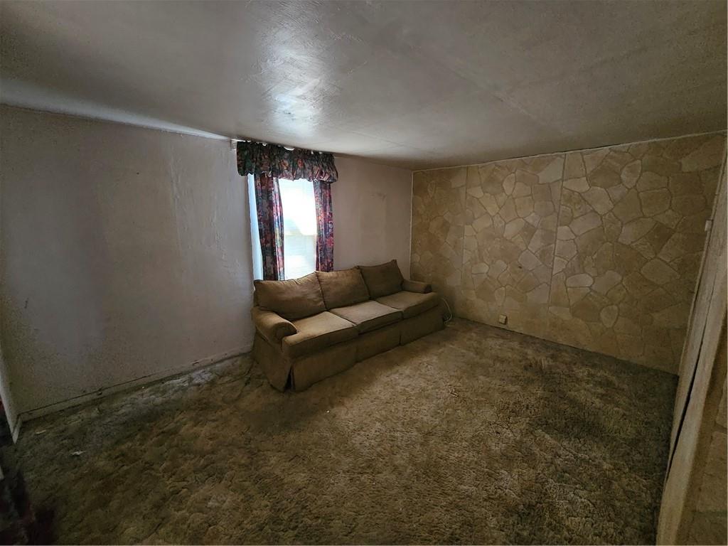 58 Elm Street Natrona Heights, PA 15065 - Photo 11 of 23 a living room with a couch and a window