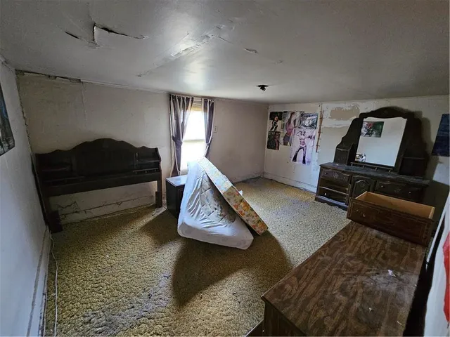 a view of room with window and hardwood floor