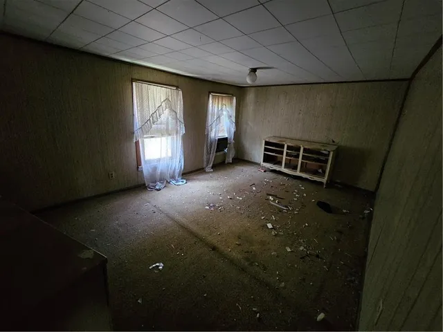 a view of empty room with windows