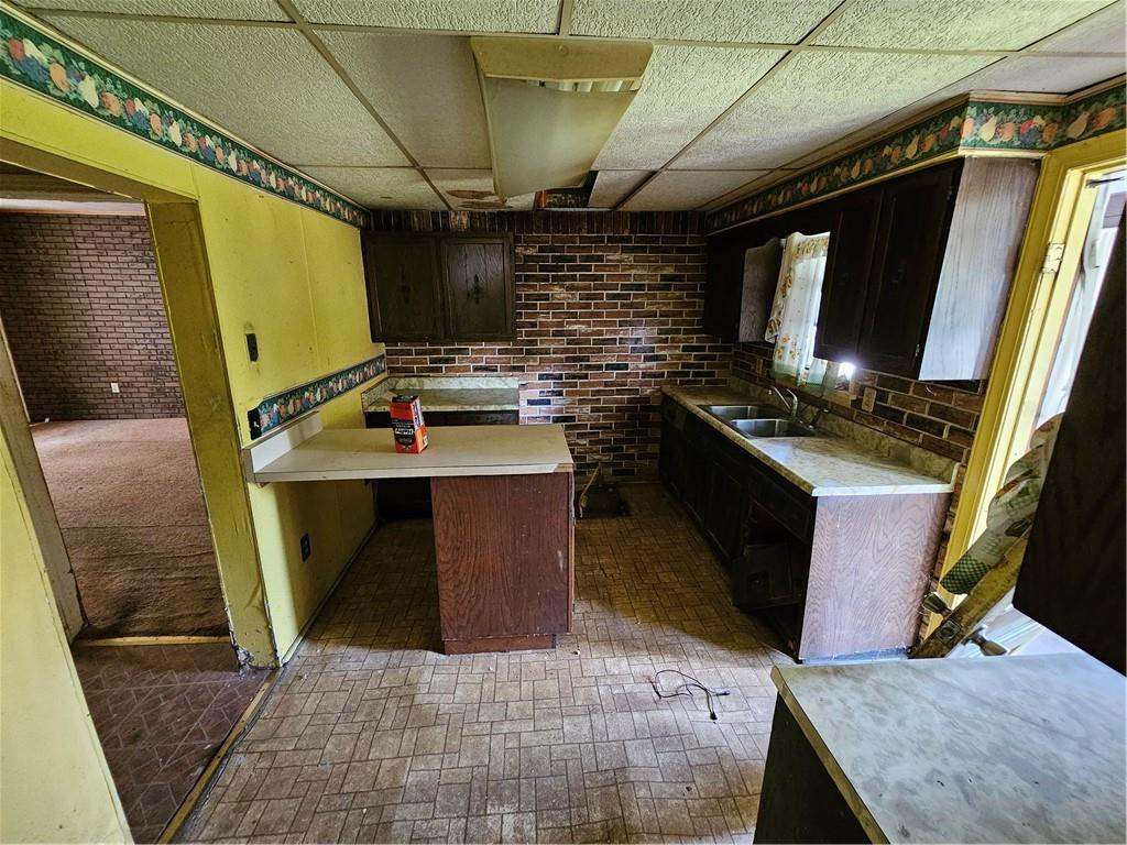 58 Elm Street Natrona Heights, PA 15065 - Photo 6 of 23 a view of kitchen with stainless steel appliances wooden floor