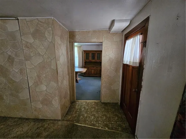 a living room with a couch and a window