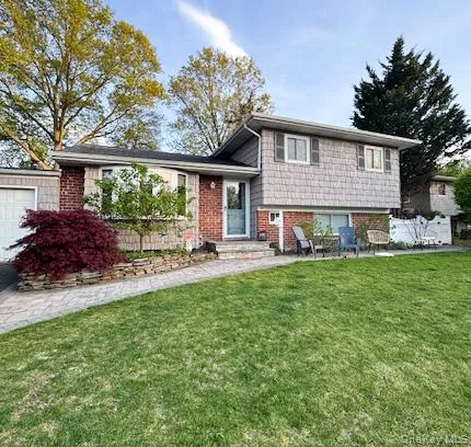 a front view of house with yard and outdoor seating