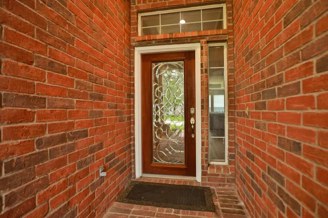 a view of a door and a window