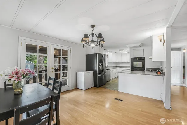 a view of a dining room with furniture window and wooden floor