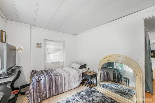 a bathroom with a toilet a sink and a shower curtain