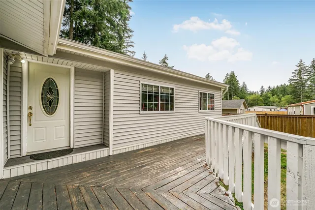 a view of a house with wooden fence