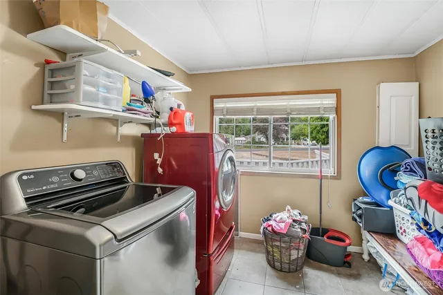 a view of a house with a yard covered in snow