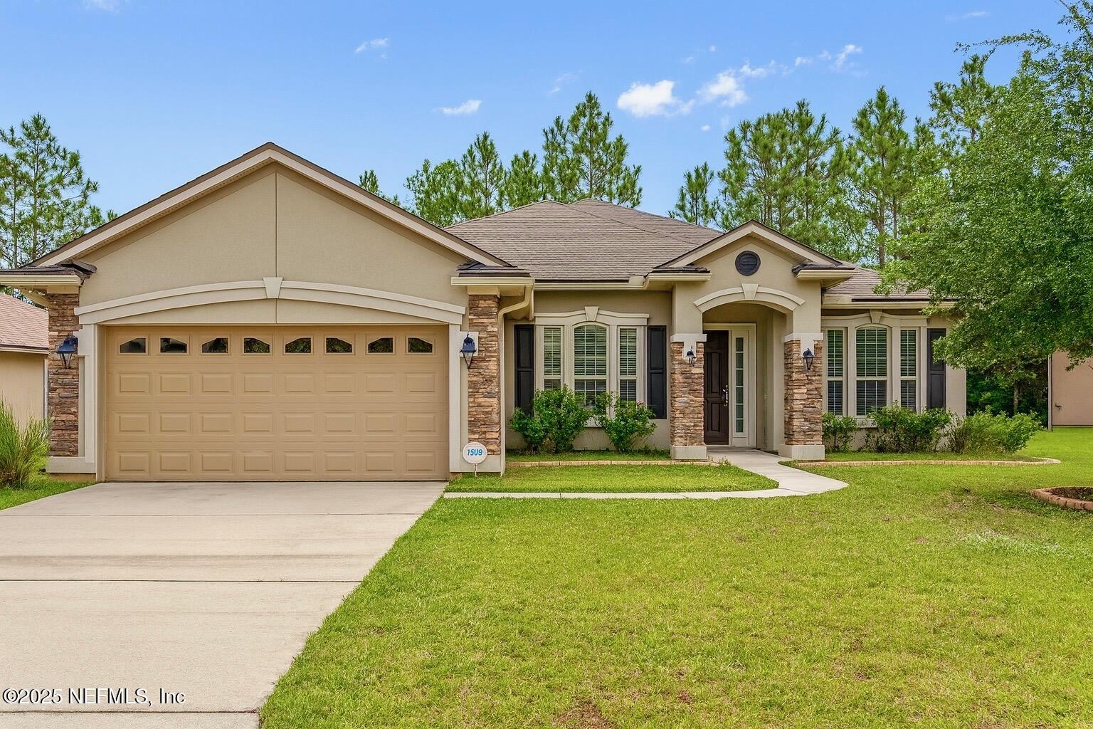 a front view of a house with a yard
