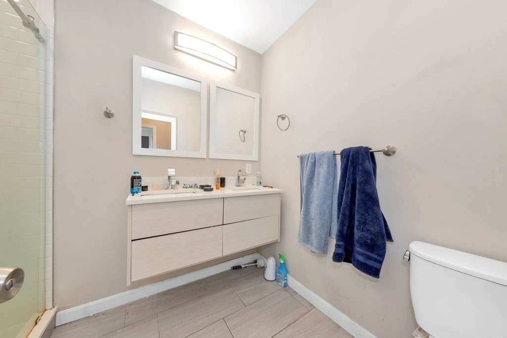 228 Calumet Street, Unit 1 Boston, MA 02120 - Photo 11 of 14 a bathroom with a sink and a mirror