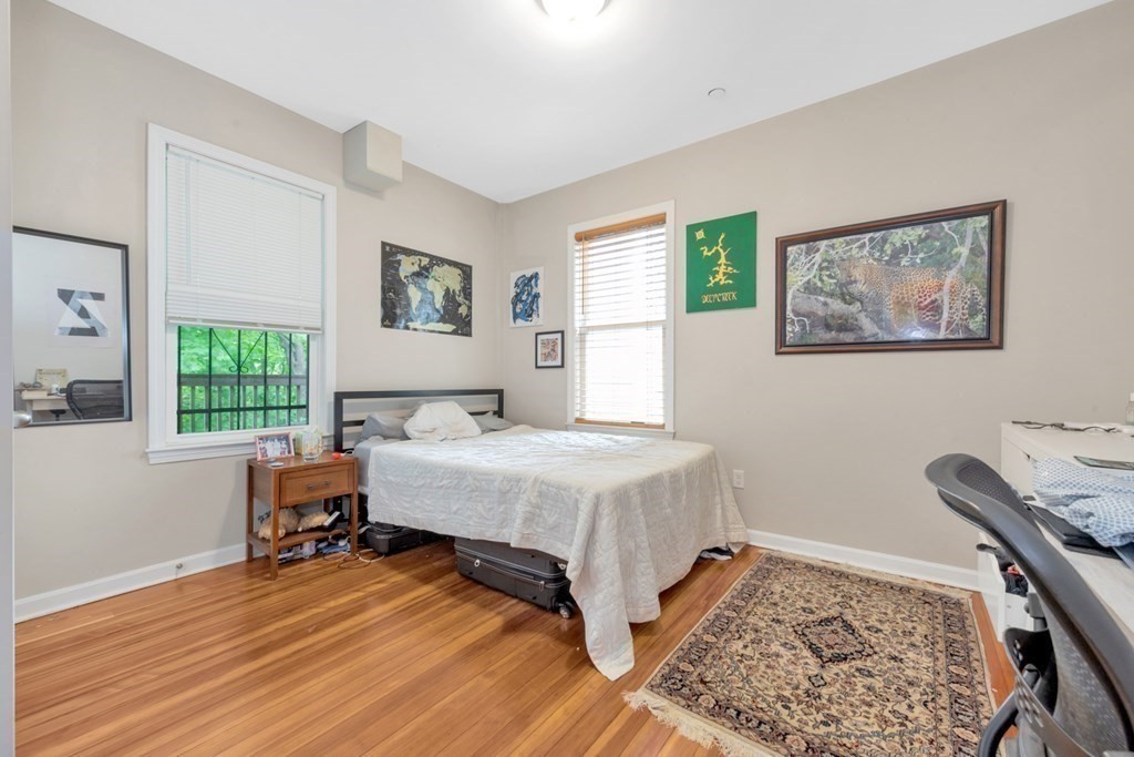 228 Calumet Street, Unit 1 Boston, MA 02120 - Photo 10 of 14 a bedroom with a bed and a window