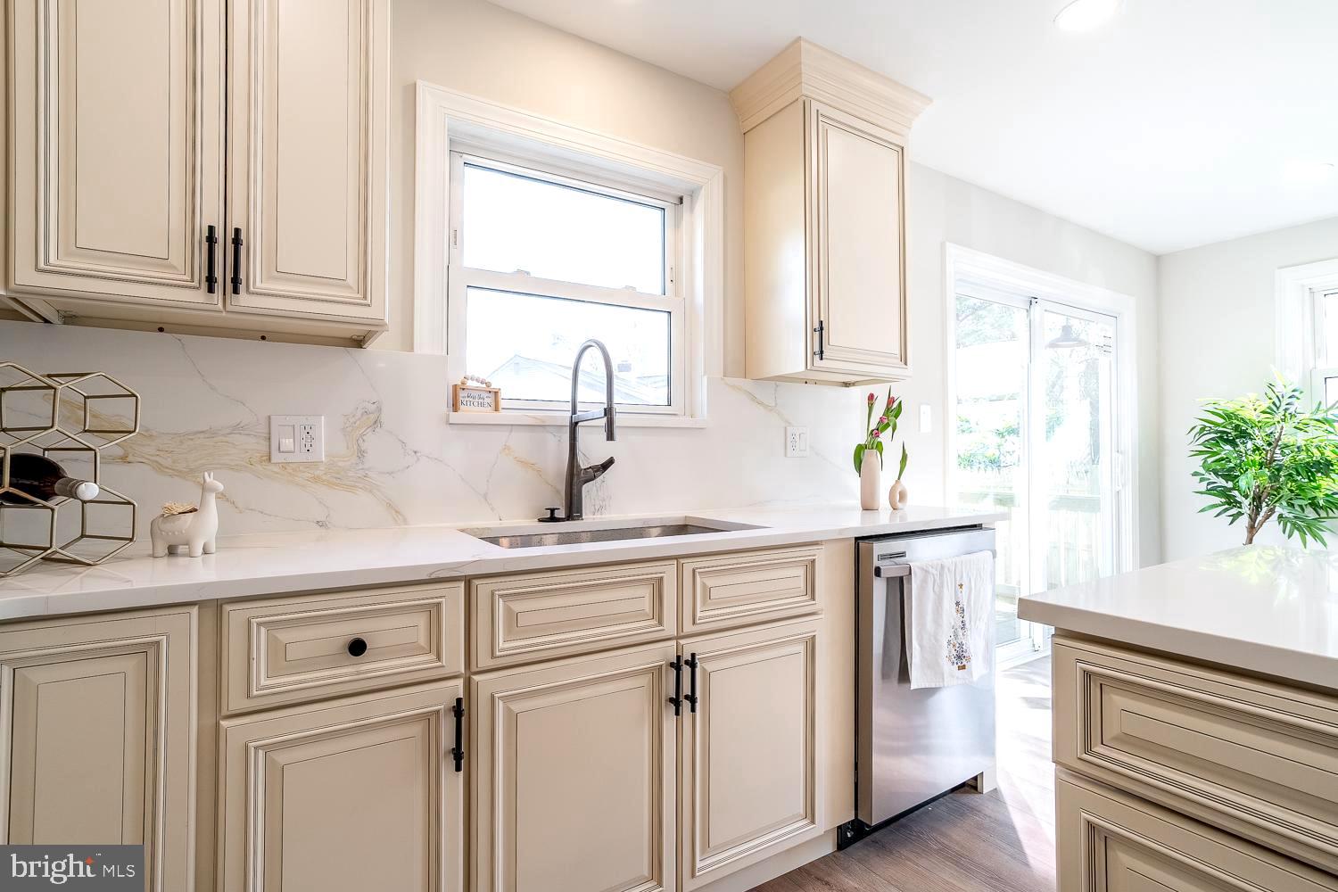 1009 Edgemoor Road Cherry Hill, NJ 08034 - Photo 20 of 49 a kitchen with white cabinets and a window