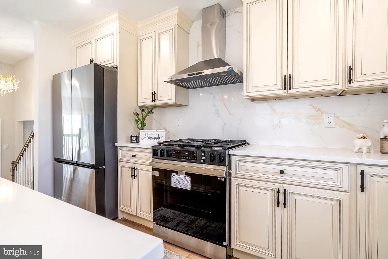 1009 Edgemoor Road Cherry Hill, NJ 08034 - Photo 22 of 49 a kitchen with stainless steel appliances granite countertop a stove a refrigerator and a cabinets