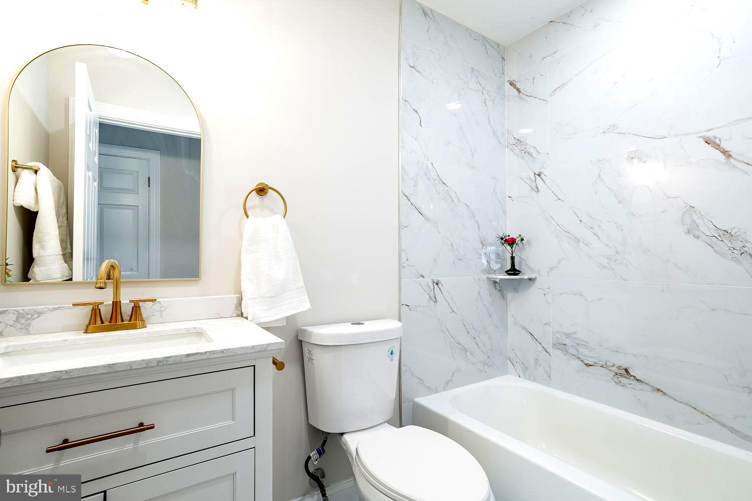 1009 Edgemoor Road Cherry Hill, NJ 08034 - Photo 25 of 49 a bathroom with a sink a toilet and a bathtub