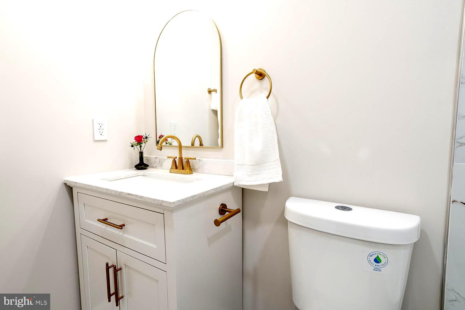 1009 Edgemoor Road Cherry Hill, NJ 08034 - Photo 26 of 49 a bathroom with a sink and mirror with toilet